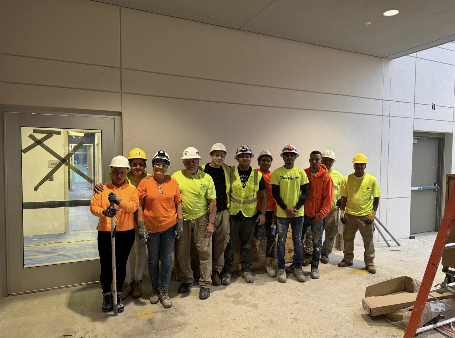 The World of Colors painting crew on a commercial job site in Tampa